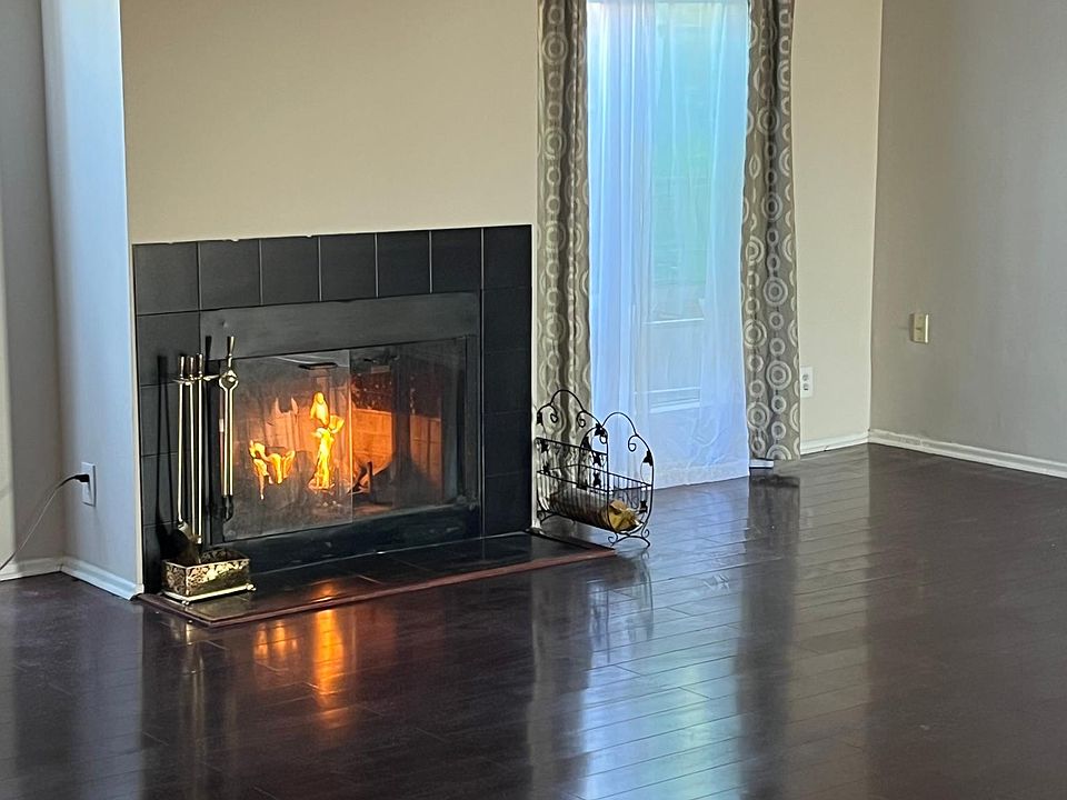 Living room with wood burning fireplace