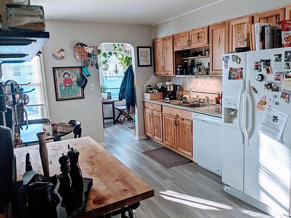 Large eat in Kitchen with updated Hickory Cabinets and appliances 17' x 12' (sunroom and side entry in background)