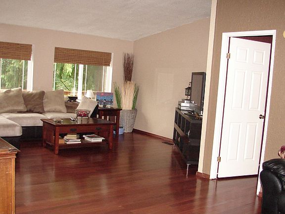 Spacious family room with vaulted ceilings. plenty of room for all your furnit