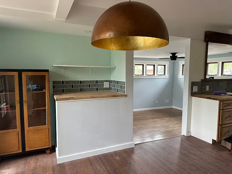 Dining area w/ designer lamp and smoothie/microwave/bar area