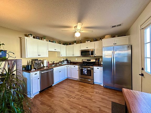 Another view of kitchen (door exits to fenced-in backyard)