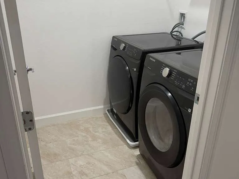 Laundry room. Big washer and dryer.