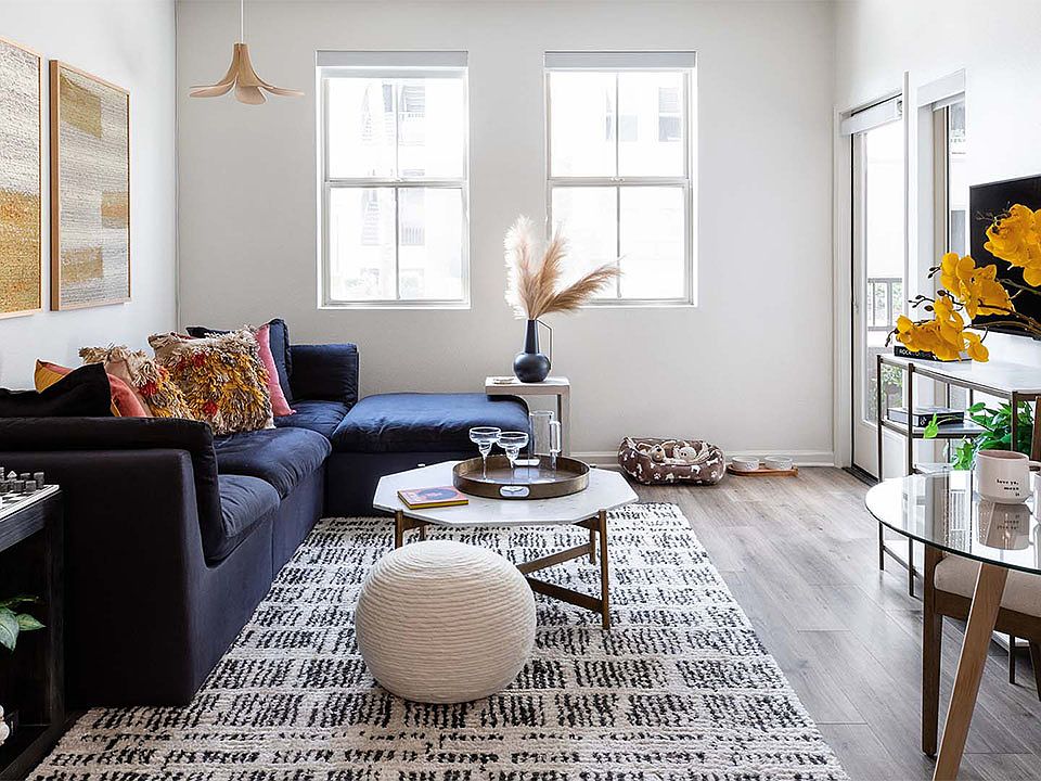 Apartment living room with wood-style flooring.