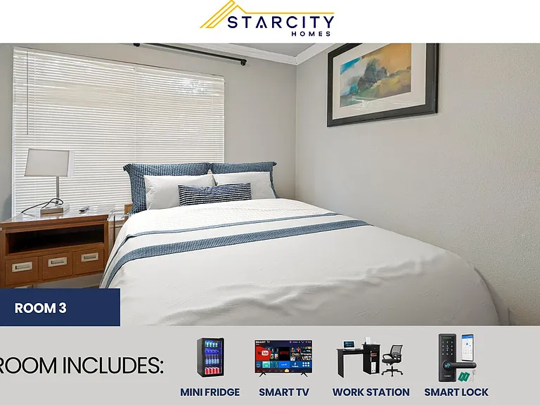 Furnished bedroom with a full bed, nightstand, and large window with blinds, offering space for restful sleep and storage.