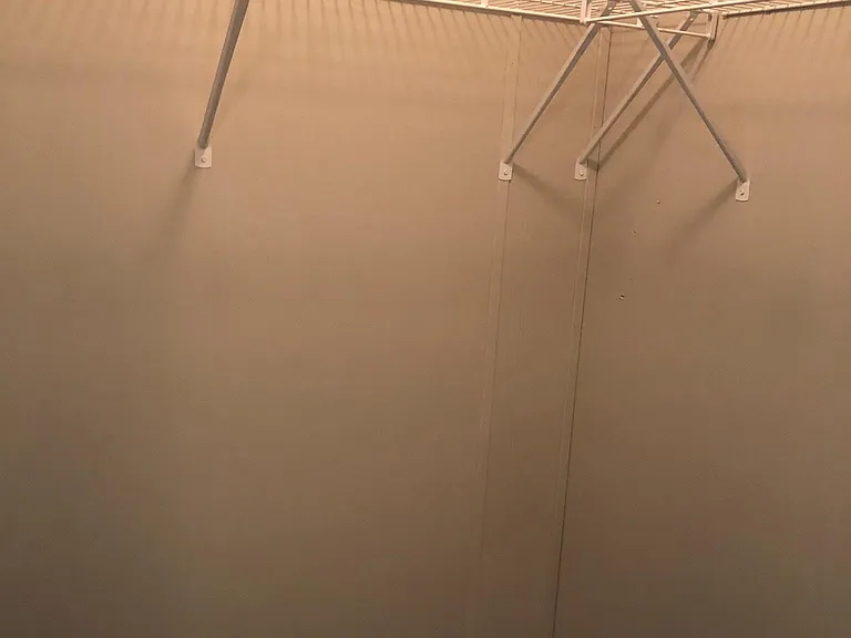 walk-in closet in second bedroom.