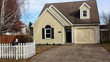 Front with nice side yard and picket fence