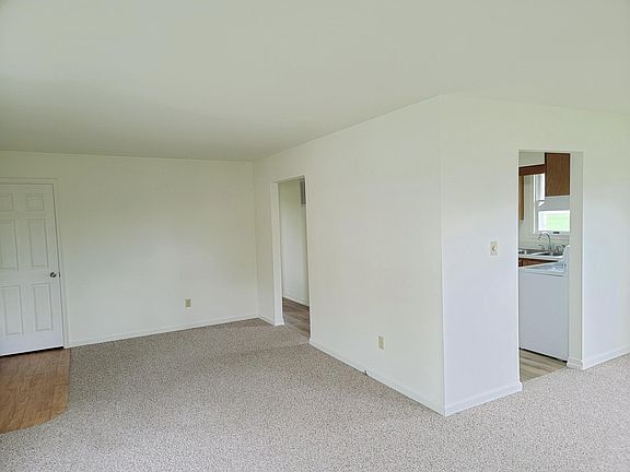 Entry/Coat Closet and Living Room Area - leads to Kitchen