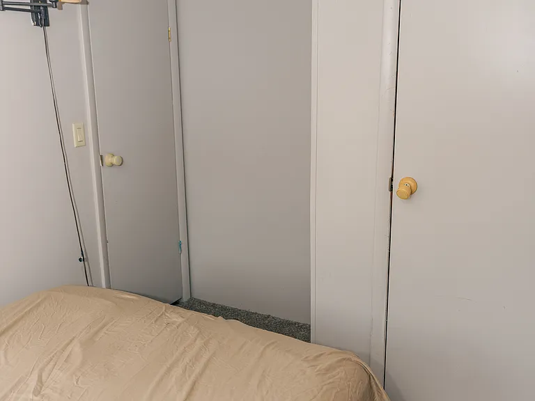 Closet and door to first bedroom