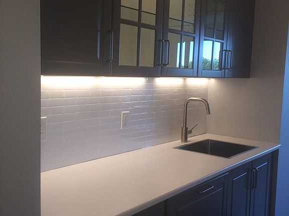 Kitchen, there is a dishwasher behind cabinet door to left of sink