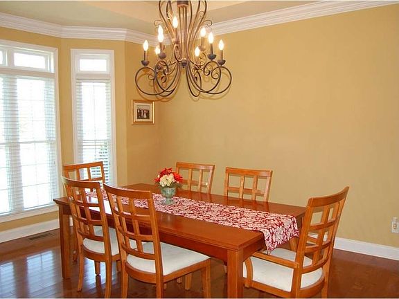 "Large windows define the dining room"