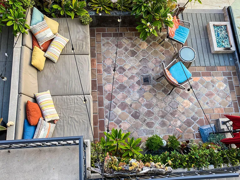 Ocean view walk street entertainment deck with Oudoor lighting, Sonos speakers, Built in outdoor couch, gas fire pit and fountain