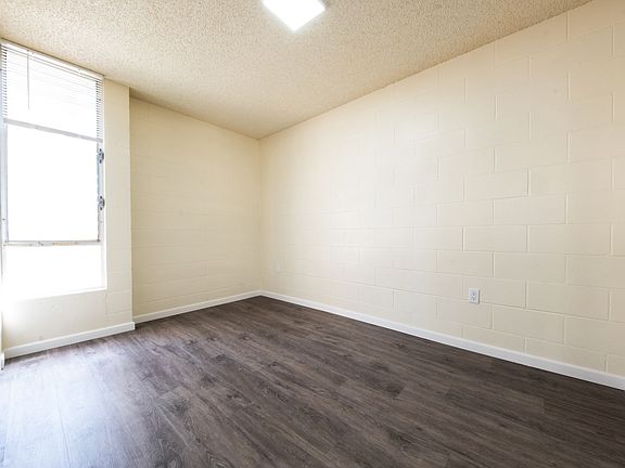 Spacious bedroom with abundant natural light.
