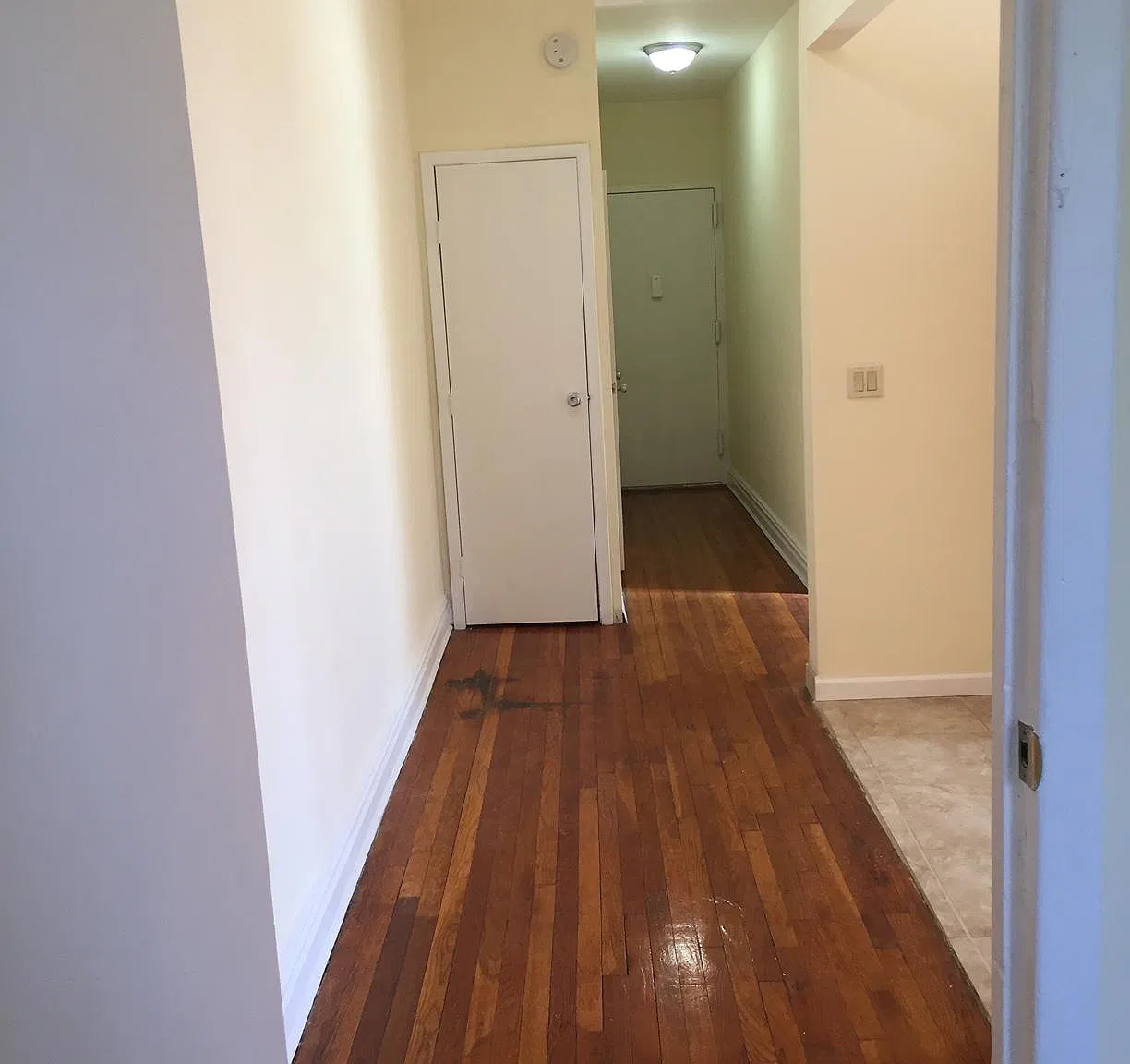 foyer to open space eat in kitchen with Italian tile floor. The foyer can accommodate another table...10 foot ceilings