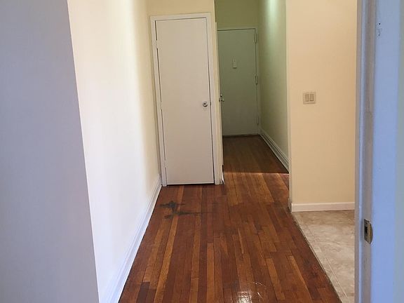 foyer to open space eat in kitchen with Italian tile floor. The foyer can accommodate another table...10 foot ceilings