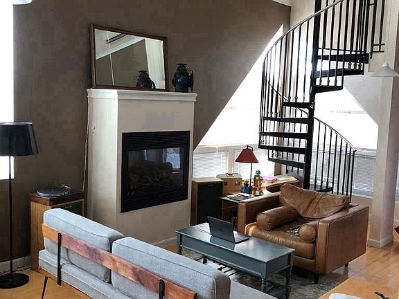 Open living/dining area with fireplace