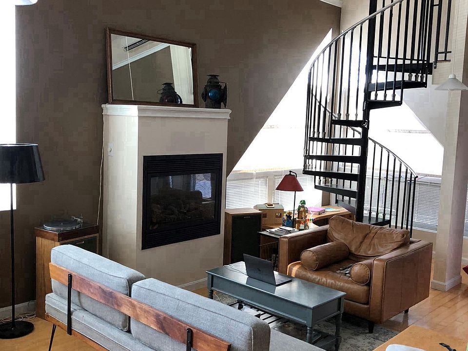 Open living/dining area with fireplace