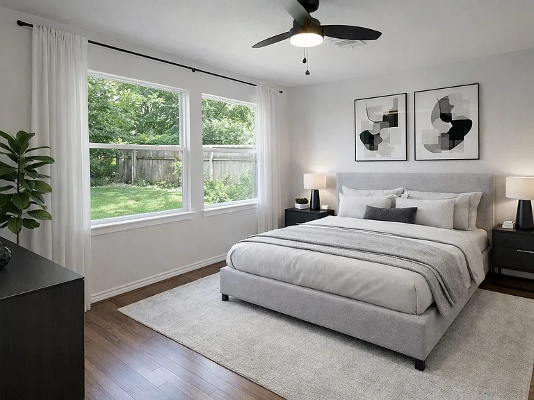 Digital stage master bedroom. This bedroom features a serene, modern design with a large window offering garden views.