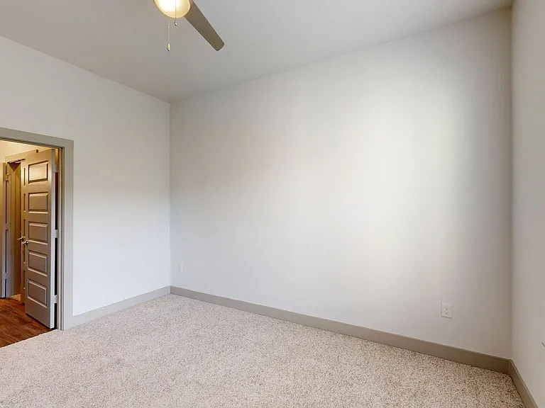 Spacious apartment Bedroom with Carpet Floor.