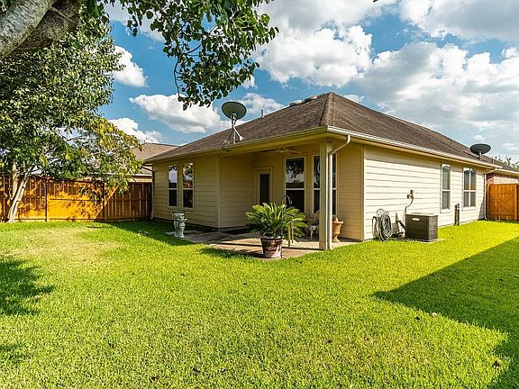 There's plenty of back yard space with a covered back patio and no back neighbors!