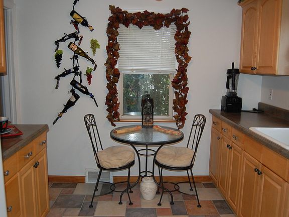 Kitchen with multiple cabinets, gas stove and refrigerator, 