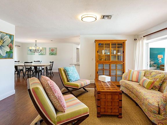 Living room with view of dining room