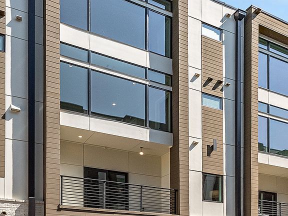 2-car garage and balcony off of living level