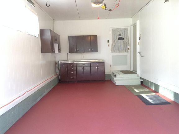Ample storage and work space in garage. New outlets and lighting so no more extension cords!