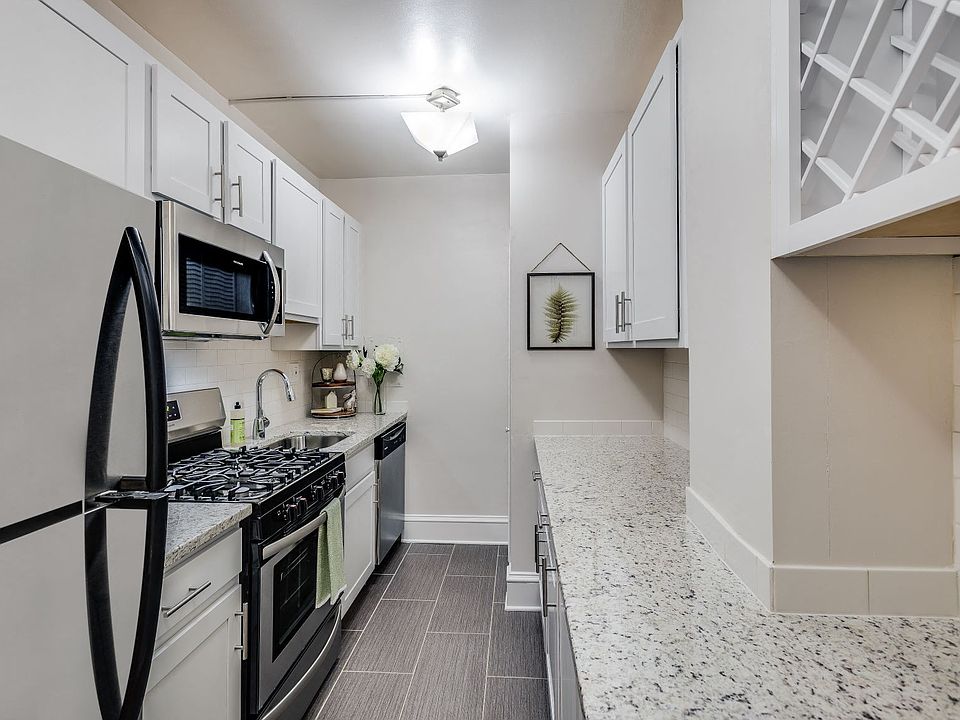 Renovated kitchen with granite countertops and stainless steel appliances