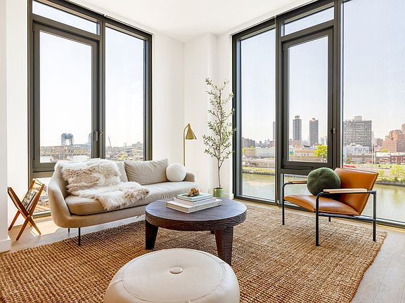 Water and city views through floor-to-ceiling windows