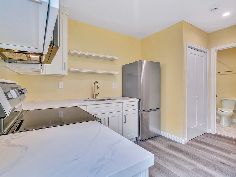 Kitchen, washer & dryer closet, and entry to bath