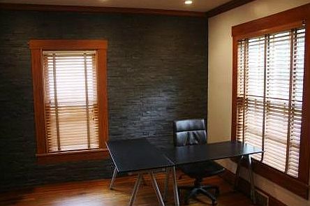 Back wall in this Den was a custom design project.  Made of natural slate.