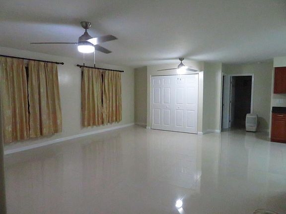 Pantry built in 2018 with double accordion doors for storage. Bedroom #2 door (see photo with air mattress), bathroom #2 and bedroom #3 behind kitchen wall.