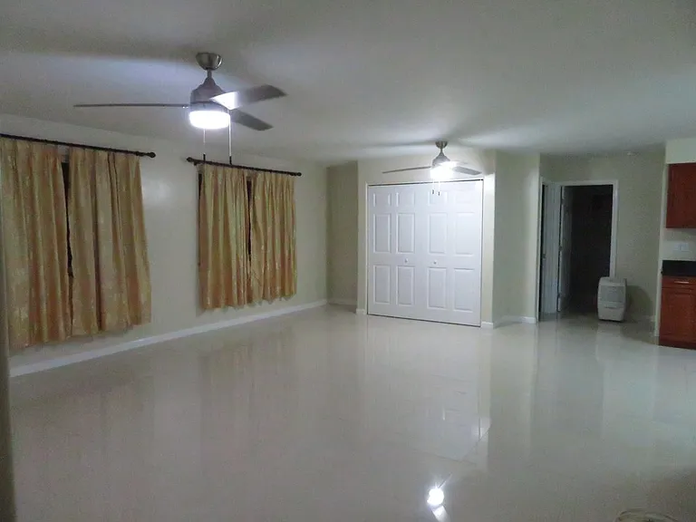 Pantry built in 2018 with double accordion doors for storage. Bedroom #2 door (see photo with air mattress), bathroom #2 and bedroom #3 behind kitchen wall.