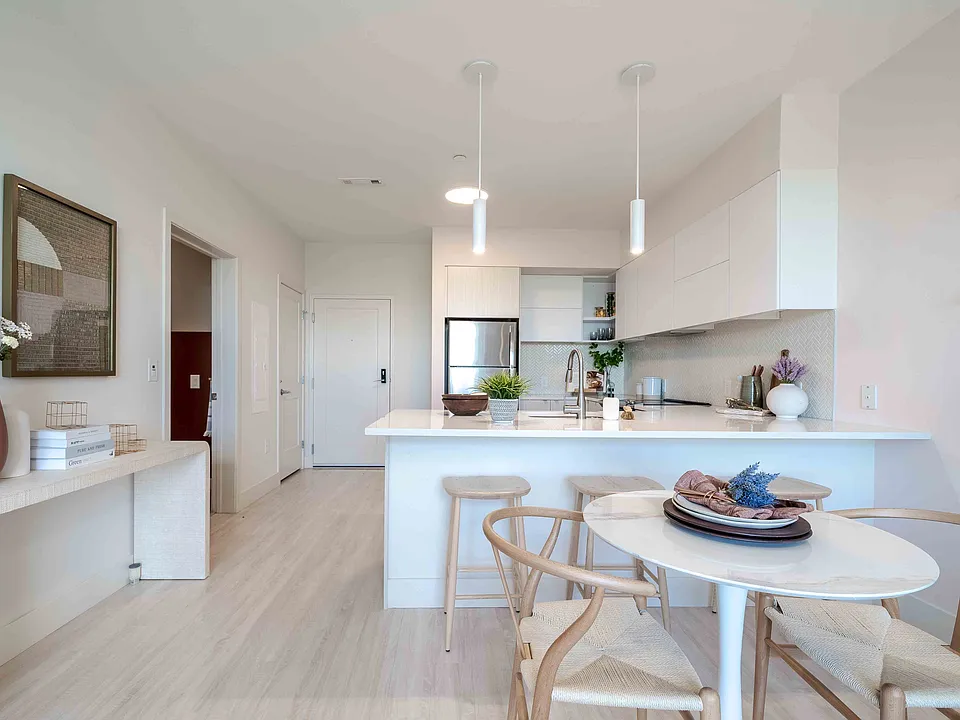 Apartment Kitchen with Breakfast Bar and Pendant Lights