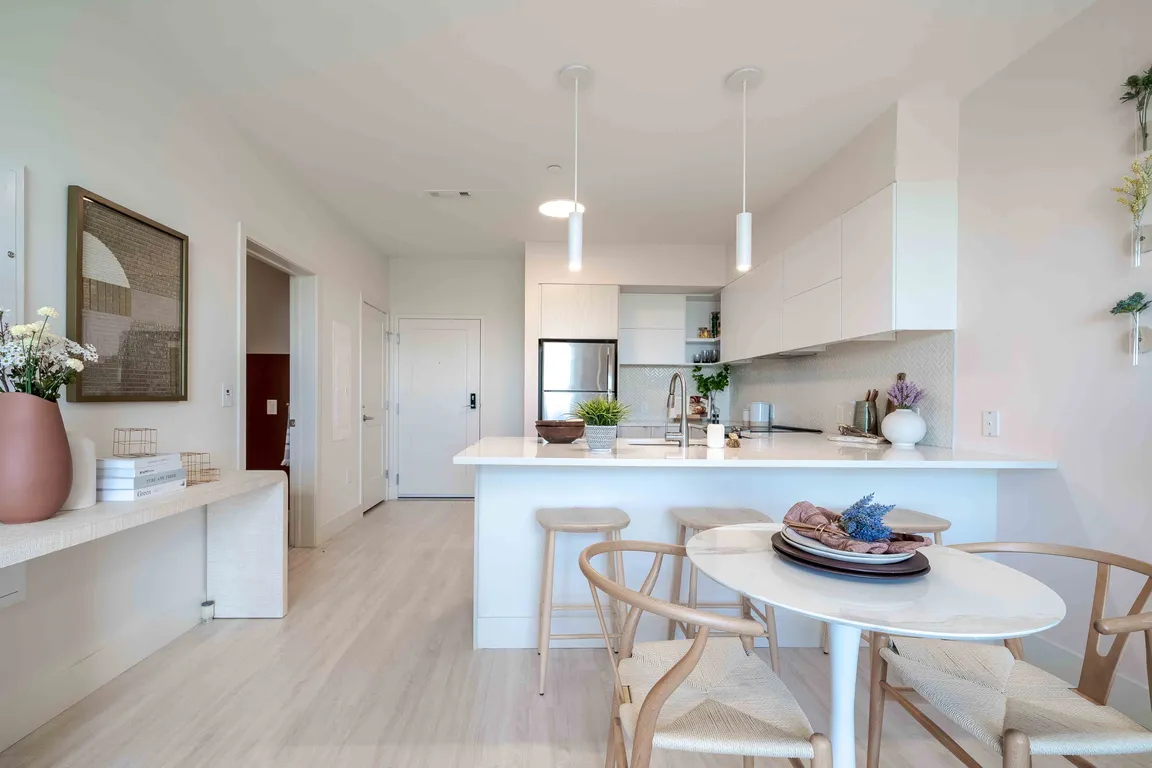 Apartment Kitchen with Breakfast Bar and Pendant Lights