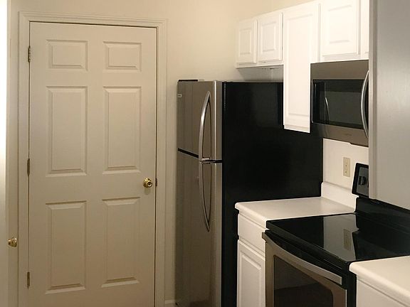 Kitchen with door to laundry/ pantry