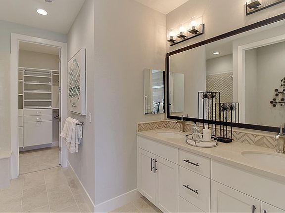 Master bedroom with en-suite bathroom and walk-in closet.