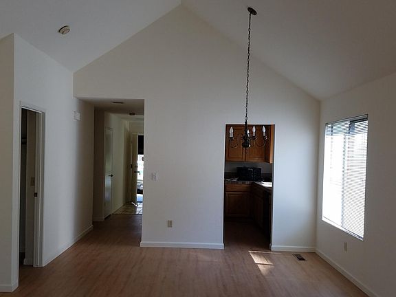 View from back of Living Room. Dining Room, Kitchen. Master