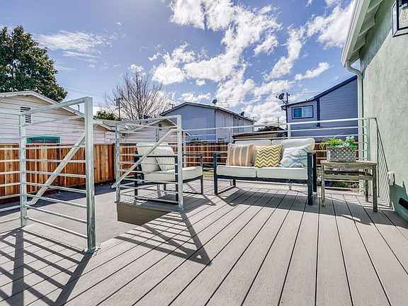 back entrance of the house, deck and separate entrance to the studio
