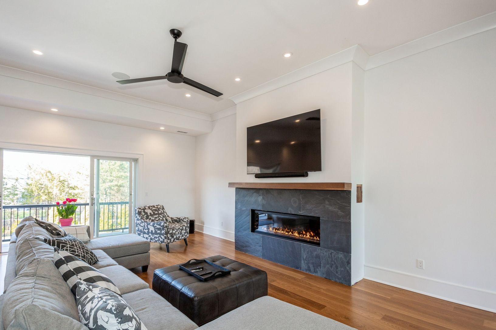  Den/ family with gas fireplace & balcony overlooking pool & manicured grounds