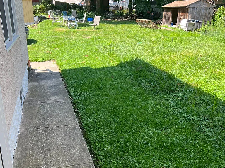 Common rear yard. Table and chairs are for tenants/guests to use