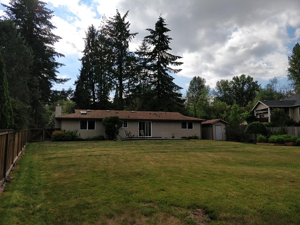 Backyard looking at the house, storage shed to the right sid