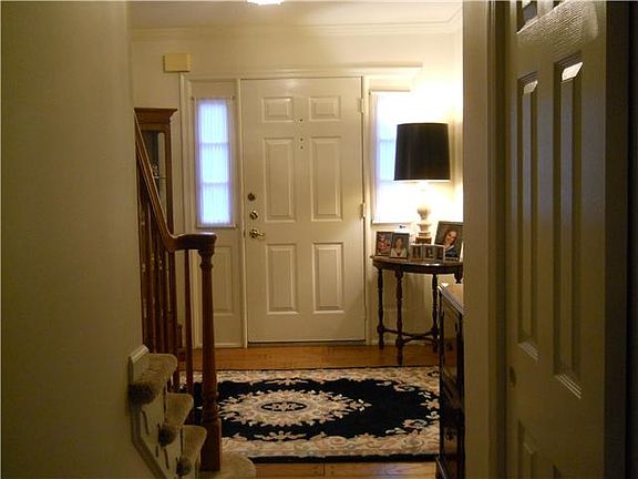 Foyer with hardwood floors