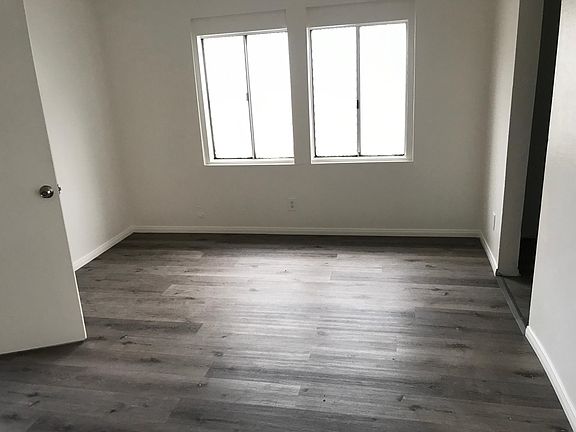 Living room, new flooring, new paint, new ceiling fan
