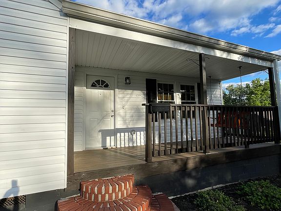 Covered front porch where you can hear courthouse bells chime.
