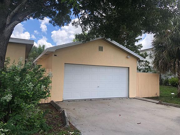 Large detached garage (almost 2 car) w/ inside laundry room and lots of storage. Includes automatic garage door opener.