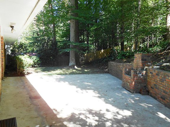 Back patio is great for grilling.
Access from den with sliding glass doors or from carport.