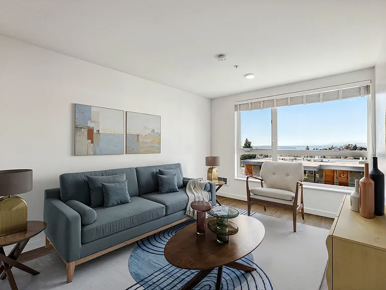 Experience urban living in this spacious living room at 4400 Alaska in Seattle, WA, featuring abundant natural light, a stunning view, and modern finishes. P...