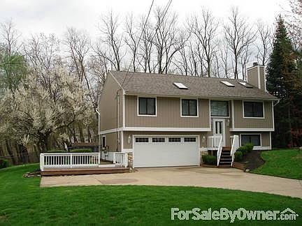 front yard
						:
						front deck, two car garage, front porch, turn around concrete, driveway