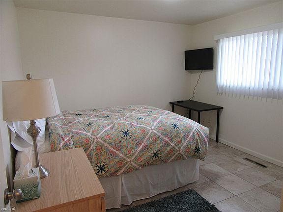 REAR BEDROOM TO LEFT OF BATHROOM 2